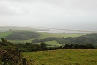 [Looking along the Chesil beach from the hills behind the fleet]