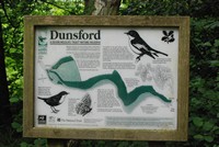 [Public information sign in the woods]