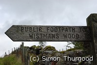 [Sign post to the wood]